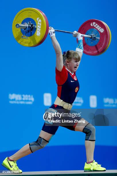 Anastasiia Petrova of Russia competes in the Women's 58kg Weightlifting on day three of the Nanjing 2014 Summer Youth Olympic Games at Nanjing...