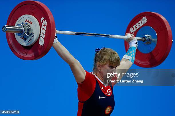 Anastasiia Petrova of Russia competes in the Women's 58kg Weightlifting on day three of the Nanjing 2014 Summer Youth Olympic Games at Nanjing...