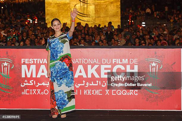Marion Cotillard presents the Michael Mann film ''Public Enemies' at Jemaa El Fna square at 13th Marrakech International Film Festival on December 5,...