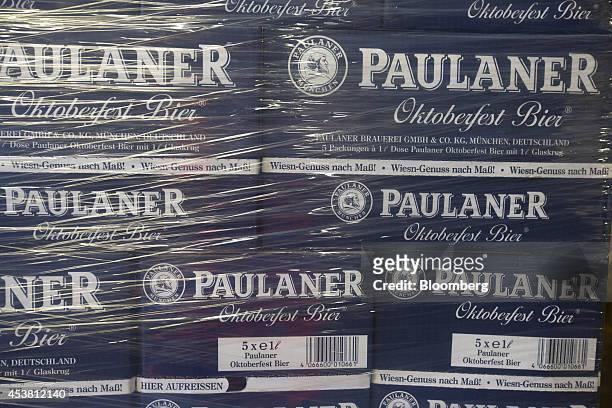 The Paulaner logo sits on stacked boxes of Oktoberfest Bier bottles before distribution at the Paulaner Brauerei GmbH brewery in Munich, Germany, on...