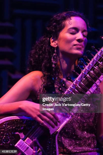 British-born Indian musician Anoushka Shankar plays sitar as she leads her ensemble during a performance at Joe's Pub, New York, New York, October...