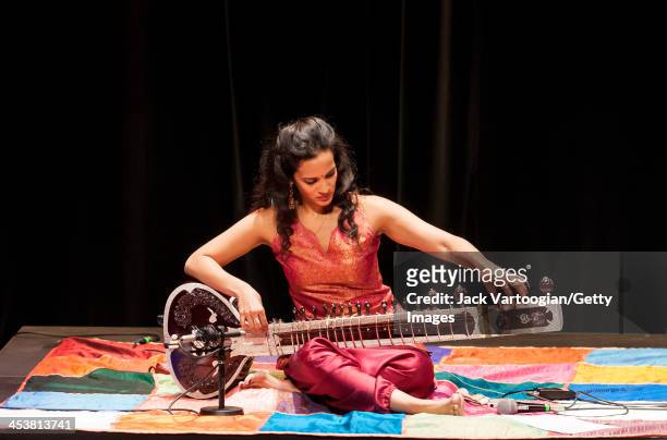 British-born Indian musician Anoushka Shankar tunes her sitar during a perfromance with her ensemble at a World Music Institute concert at New York...