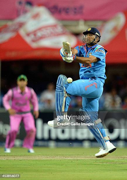 Dhoni of India pulls a delivery during the 1st Momentum ODI match between South Africa and India at Bidvest Wanderers Stadium on December 05, 2013 in...