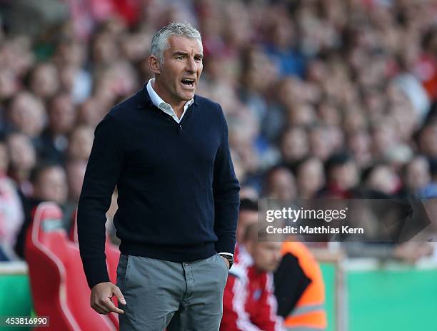 Head coach Mirko Slomka of Hamburg gestures during the DFB Cup match between FC Energie Cottbus and Hamburger SV at Stadion der Freundschaft on...