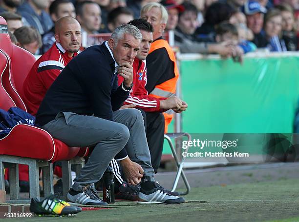Head coach Mirko Slomka of Hamburg looks on during the DFB Cup match between FC Energie Cottbus and Hamburger SV at Stadion der Freundschaft on...
