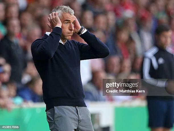 Head coach Mirko Slomka of Hamburg gestures during the DFB Cup match between FC Energie Cottbus and Hamburger SV at Stadion der Freundschaft on...