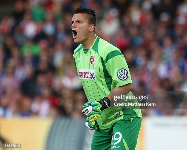 Goalkeeper Kevin Mueller of Cottbus gestures during the DFB Cup match between FC Energie Cottbus and Hamburger SV at Stadion der Freundschaft on...