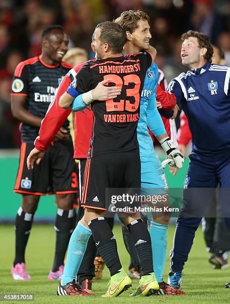 Rafael van der Vaart of Hamburg and team mate Rene Adler show their delight after winning the DFB Cup match between FC Energie Cottbus and Hamburger...