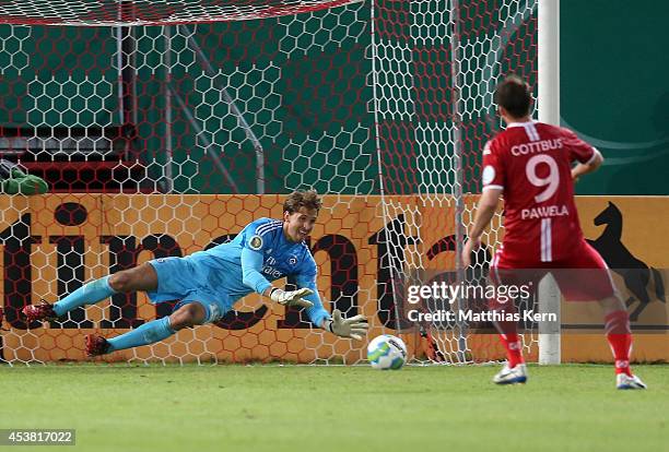 Goalkeeper Rene Adler of Hamburg holds the ball during the DFB Cup match between FC Energie Cottbus and Hamburger SV at Stadion der Freundschaft on...