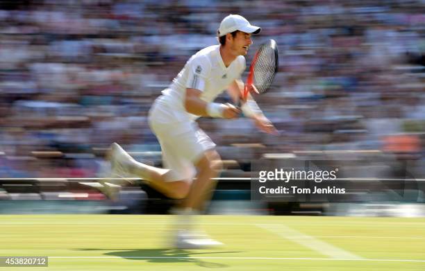 Andy Murray chases after the ball during the mens singles final versus Novak Djokovic on Centre Court during Wimbledon 2013 day thirteen at the All...
