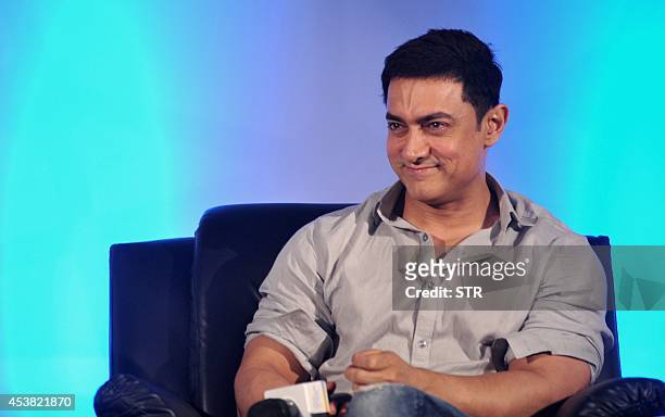 Indian Bollywood film actor Aamir Khan poses during the launch of 'Young Inspirators Network' in Mumbai on August 19, 2014. AFP PHOTO