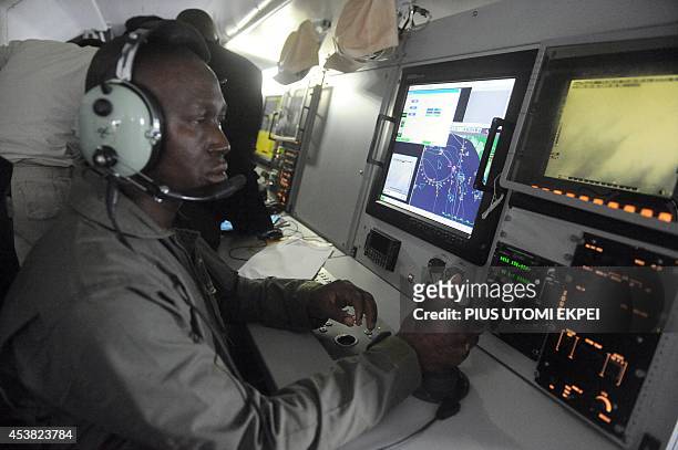 Nigerian Airforce pilots sit to monitor vessels from ATR 42-500 Maritime Patrol Aircraft acquired to fight maritime crime in collaboration with the...