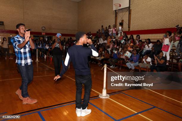 Singer and actor Trevor Jackson and rapper Diggy Simmons performs their single, "My Girl" at the Foster Park Fieldhouse on August 9, 2014 in Chicago,...