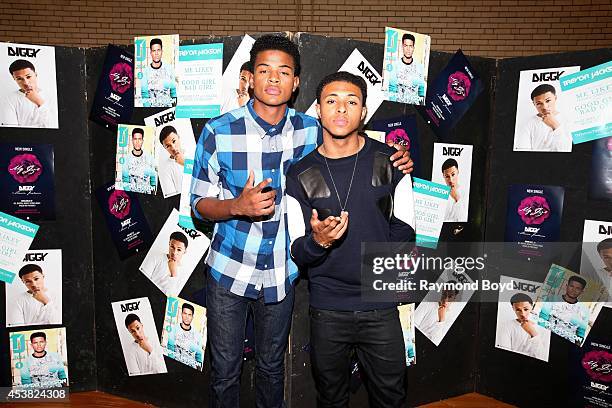 Singer and actor Trevor Jackson and rapper Diggy Simmons poses for photos at the Foster Park Fieldhouse on August 9, 2014 in Chicago, Illinois.