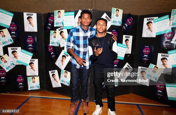 Singer and actor Trevor Jackson and rapper Diggy Simmons poses for photos at the Foster Park Fieldhouse on August 9, 2014 in Chicago, Illinois.