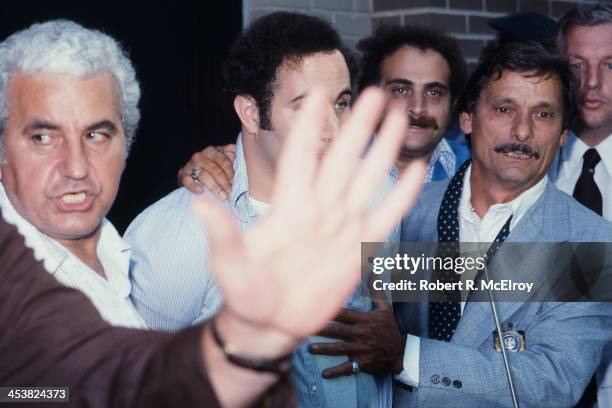 Police officers escort American accused serial killer David Berkowitz , known as the Son of Sam, into the 84th precinct station, New York, New York,...