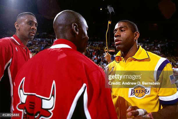 Michael Jordan of the Chicago Bulls and Magic Johnson of the Los Angeles Lakers greet each other during Game Three of the 1991 NBA Finals on June 7,...