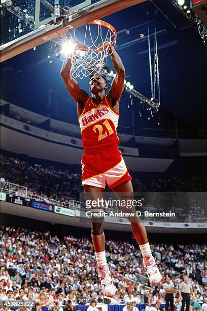Dominique Wilkins of the Atlanta Hawks dunks during the 1990 NBA All-Star Slam Dunk Contest on February 10, 1990 at Miami Arena in Miami,Florida....