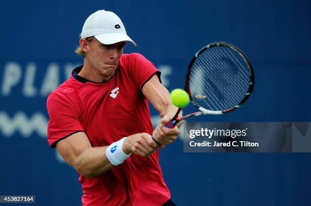 Kevin Anderson of South Africa returns a shot from Adrian Mannarino of France during the Winston-Salem Open at Wake Forest University on August 19,...