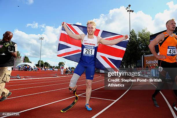 Jonnie Peacock of Great Britain celebrates winning the Men's 100m T44 event during day one of the IPC Athletics European Championships at Swansea...