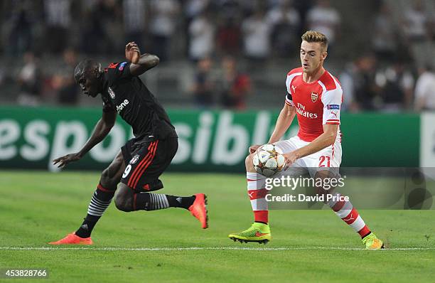 Calum Chambers of Arsenal challenges Demba Ba of Besiktas during the match between Besiktas and Arsenal in the UEFA Champions League Qualifier 1st...