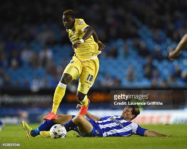 Magaye Gueye of Millwall jumps the challenge of Sam Hutchinson of Sheffield Wednesday during the Sky Bet Championship match between Sheffield...