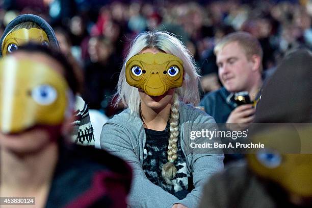 Fans of the film "ET: The Extra Terrestrial" take party in a photocall ahead of the Film4 screening at Somerset House on August 19, 2014 in London,...