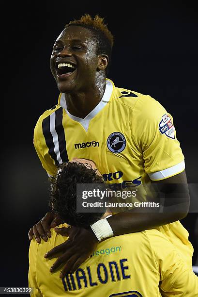 Magaye Gueye of Millwall celebrates his last minute equalising goal with Scott Malone during the Sky Bet Championship match between Sheffield...