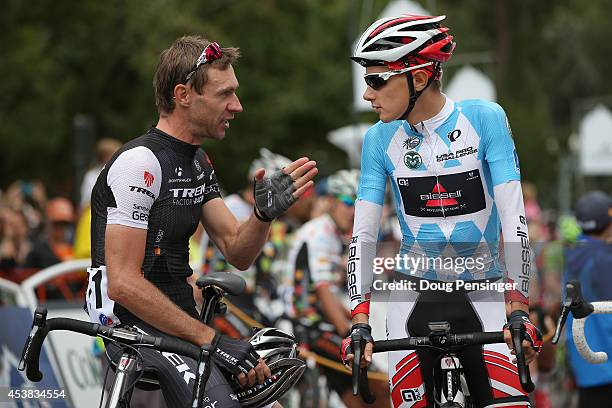 Jens Voigt of Germany riding for Trek Factory Racing and Clement Chevrier of France riding for the Bissell Development Team talk at the start of...