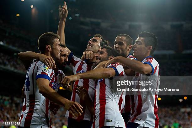 Raul Garcia of Atletico de Madrid celebrates scoring the opening goal with teammates Raul Jimenez , Mario Suarez , Diego Godin , Juan Francisco...