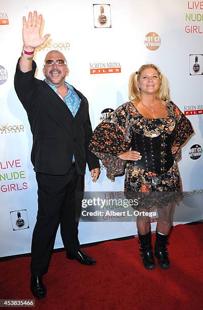 Adult film actors James Bartholet and Ginger Lynn arrive at the premiere of "Live Nude Girls" held at Avalon on August 12, 2014 in Hollywood,...