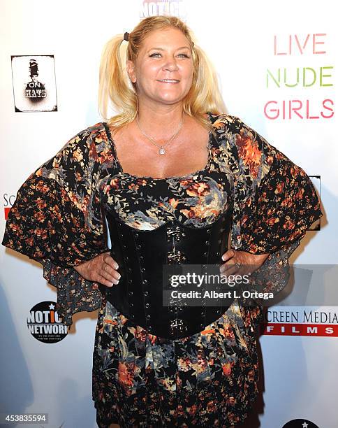 Adult film actress Ginger Lynn arrives at the premiere of "Live Nude Girls" held at Avalon on August 12, 2014 in Hollywood, California.