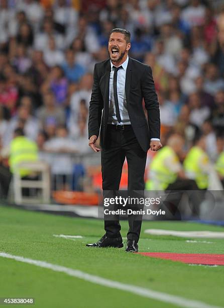 Head coach Diego Simeone of Club Atletico de Madrid looks on during the Supercopa first leg match between Real Madrid and Club Atletico de Madrid at...