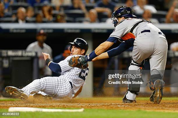 Jacoby Ellsbury of the New York Yankees is thrown out at homeplete in the eighth inning against the Houston Astros at Yankee Stadium on August 19,...