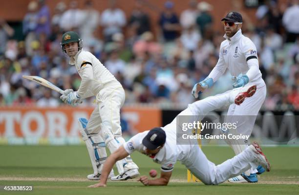 Australia captain Michael Clarke hits past England captain Alastair Cook and wicketkeeper Matt Prior during day two of the Second Ashes Test Match...