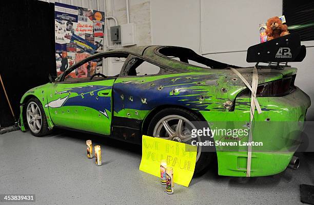 Brian O'Connor's 1995 Mitsubishi Eclipse stunt car from the movie "Fast & Furious" is used as a memorial for Paul Walker at Dezer Collection inside...