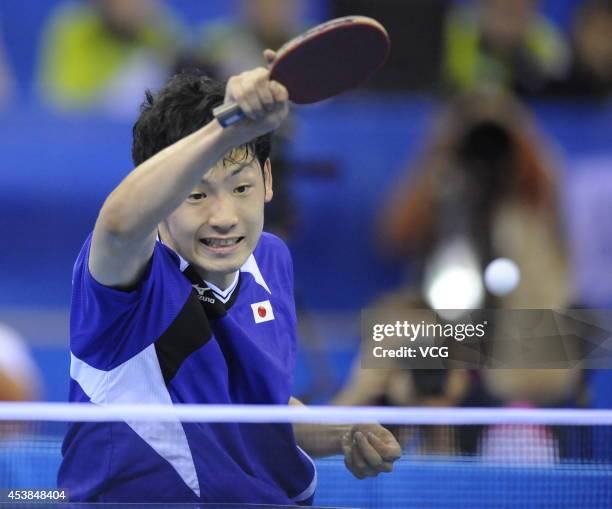 Yuto Muramatsu of Japan competes with Fan Zhendong of China in the Men's Table Tennis Singles final match on day four of the Nanjing 2014 Summer...