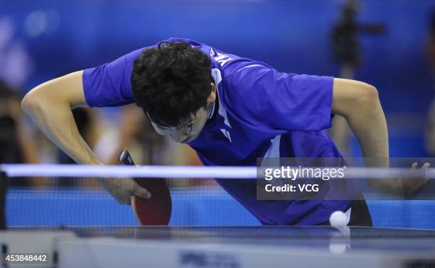 Yuto Muramatsu of Japan competes with Fan Zhendong of China in the Men's Table Tennis Singles final match on day four of the Nanjing 2014 Summer...