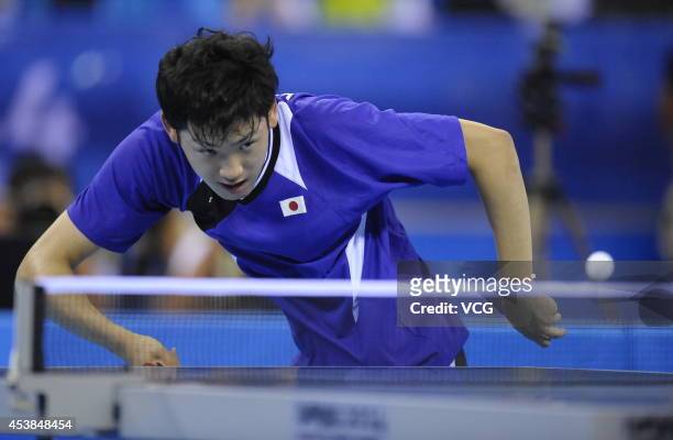 Yuto Muramatsu of Japan competes with Fan Zhendong of China in the Men's Table Tennis Singles final match on day four of the Nanjing 2014 Summer...