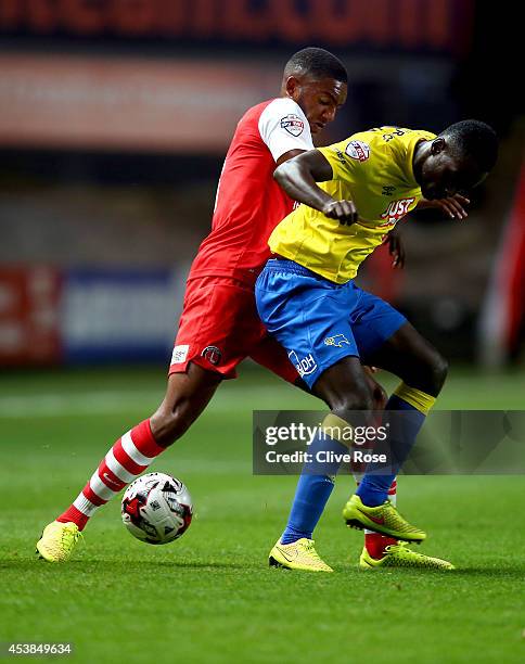 Simon Dawkins of Derby County is challenged by Craig Forsyth of Charlton during the Sky Bet Championship match between Charlton Athletic and Derby...