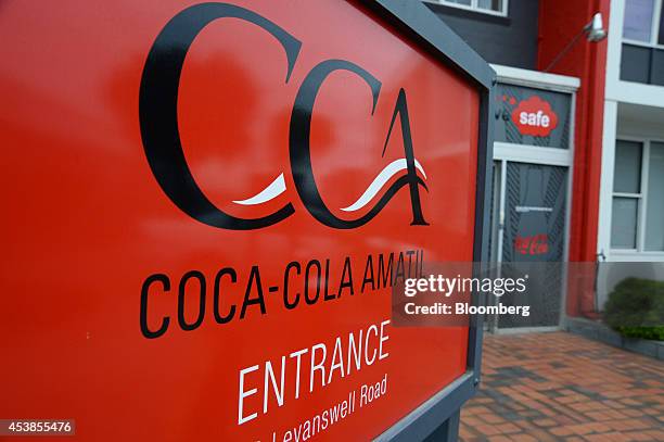 The Coca-Cola Amatil Ltd. Logo is displayed on a sign at the entrance to the company's production facility in Melbourne, Australia, on Tuesday, Aug....