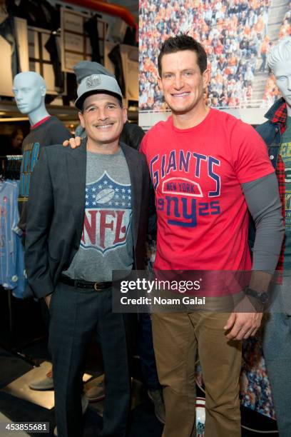 Stylist Phillip Bloch and New York Giants punter Steve Weatherford attend Junk Food Clothing's 2014 NFL Playoff Tailgate Party at Bloomingdale's on...