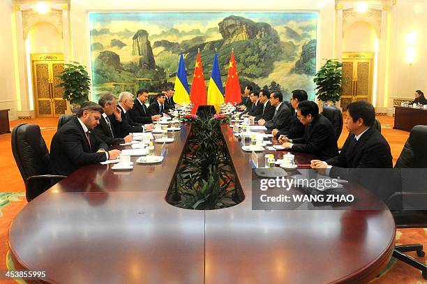 Ukrainian President Viktor Yanukovych meets with Chinese Premier Li Keqiang at the Great Hall of the People in Beijing on December 6, 2013.Yanukovych...