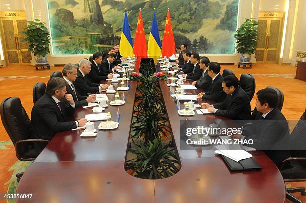 Ukrainian President Viktor Yanukovych meets with Chinese Premier Li Keqiang at the Great Hall of the People in Beijing on December 6, 2013.Yanukovych...