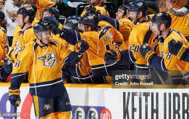 Victor Bartley of the Nashville Predators celebrates a goal with the bench against the Carolina Hurricanes at Bridgestone Arena on December 5, 2013...