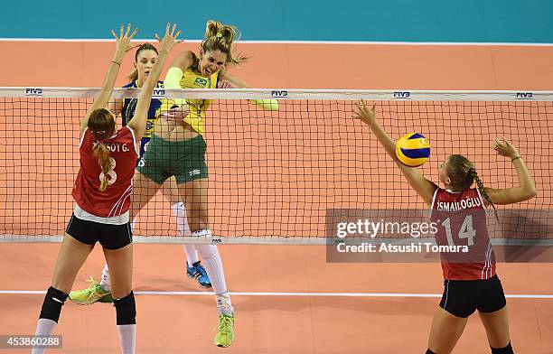 Menezes Thaisa of Brazil spikes the ball against Turkey during the FIVB World Grand Prix Final - Group 1 on August 20, 2014 in Tokyo, Japan.