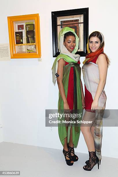 Ngozi Assata and Olya Grynko attend "love art, give a smile" Art Fashion And Design Benefit at Clen Gallery on December 5, 2013 in New York City.