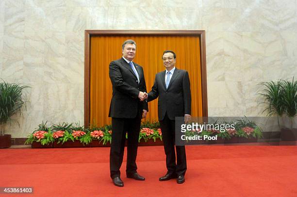 Ukrainian President Viktor Yanukovych meets with Chinese Premier Li Keqiang at the Great Hall of the People in Beijing on December 6, 2013 in...
