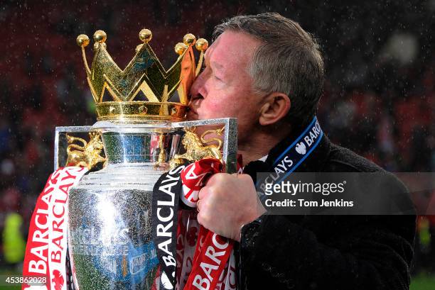 Sir Alex Ferguson kisses the Premier League trophy after the Manchester United versus Swansea City FA Premier League match, the final home game for...