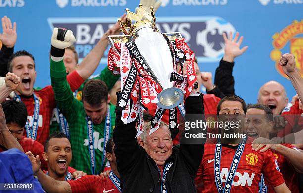Sir Alex Ferguson lifts the Premier League trophy after the Manchester United versus Swansea City FA Premier League match, the final home game for...